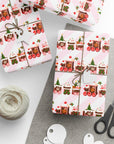 Gift box with a gingerbread Christmas train wrapping paper on table with tape