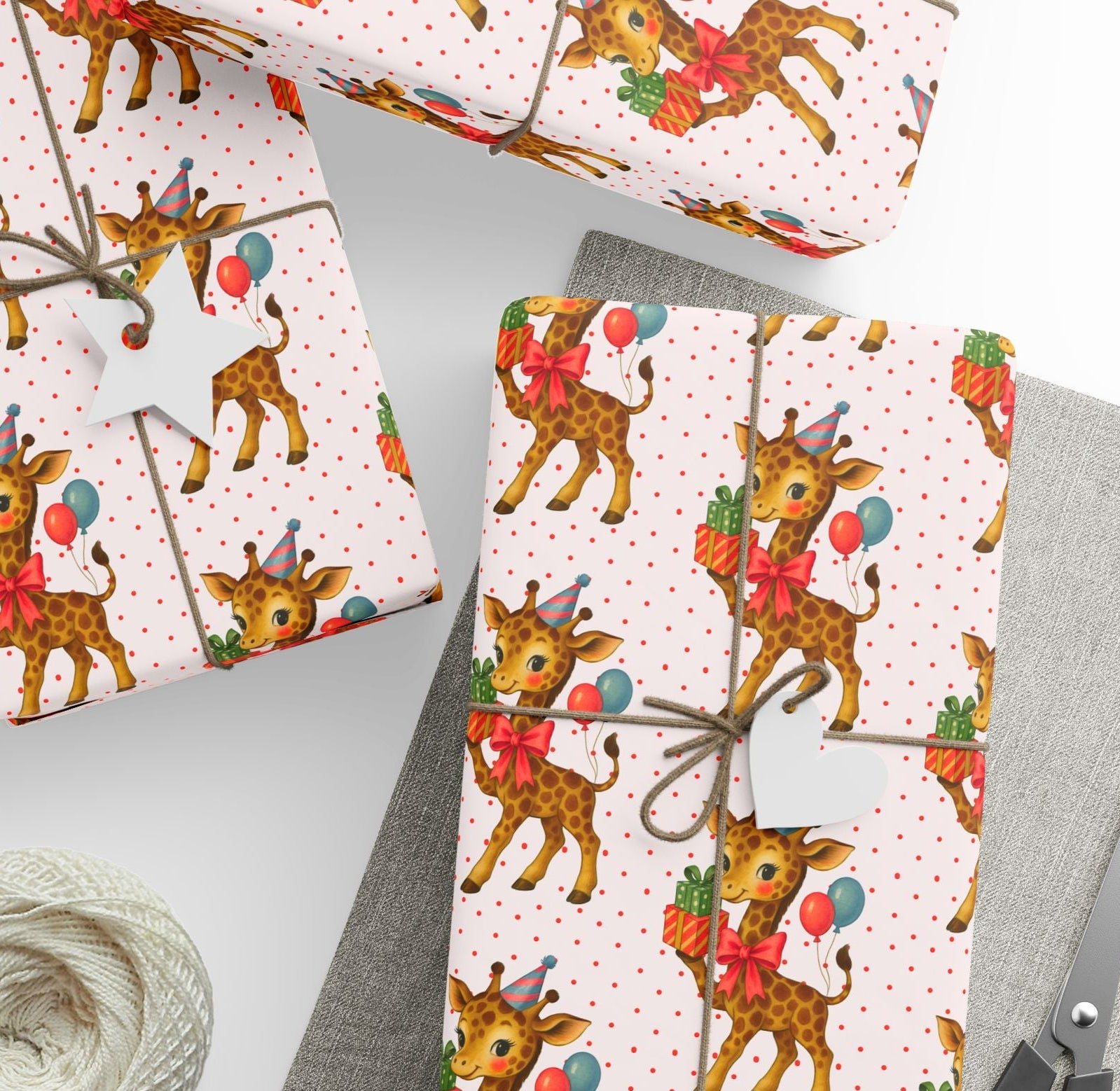 Animal theme wrapping paper for childrens birthdays featuring a giraffe wearing a party hat with balloons and presents on dotted background