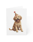 goldendoodle puppy wearing a party hat on a white background