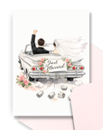 Wedding congratulations card with brunette bride and groom driving away in just married vintage convertible with pink envelope.