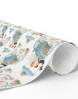 wedding wrapping paper roll featuring a bride and groom making a quick getaway in their carriage with a sign that says "Just Married"