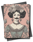 Greeting card with a vintage-style illustration of a woman with flowers in her hair on a pink floral patterned background.
