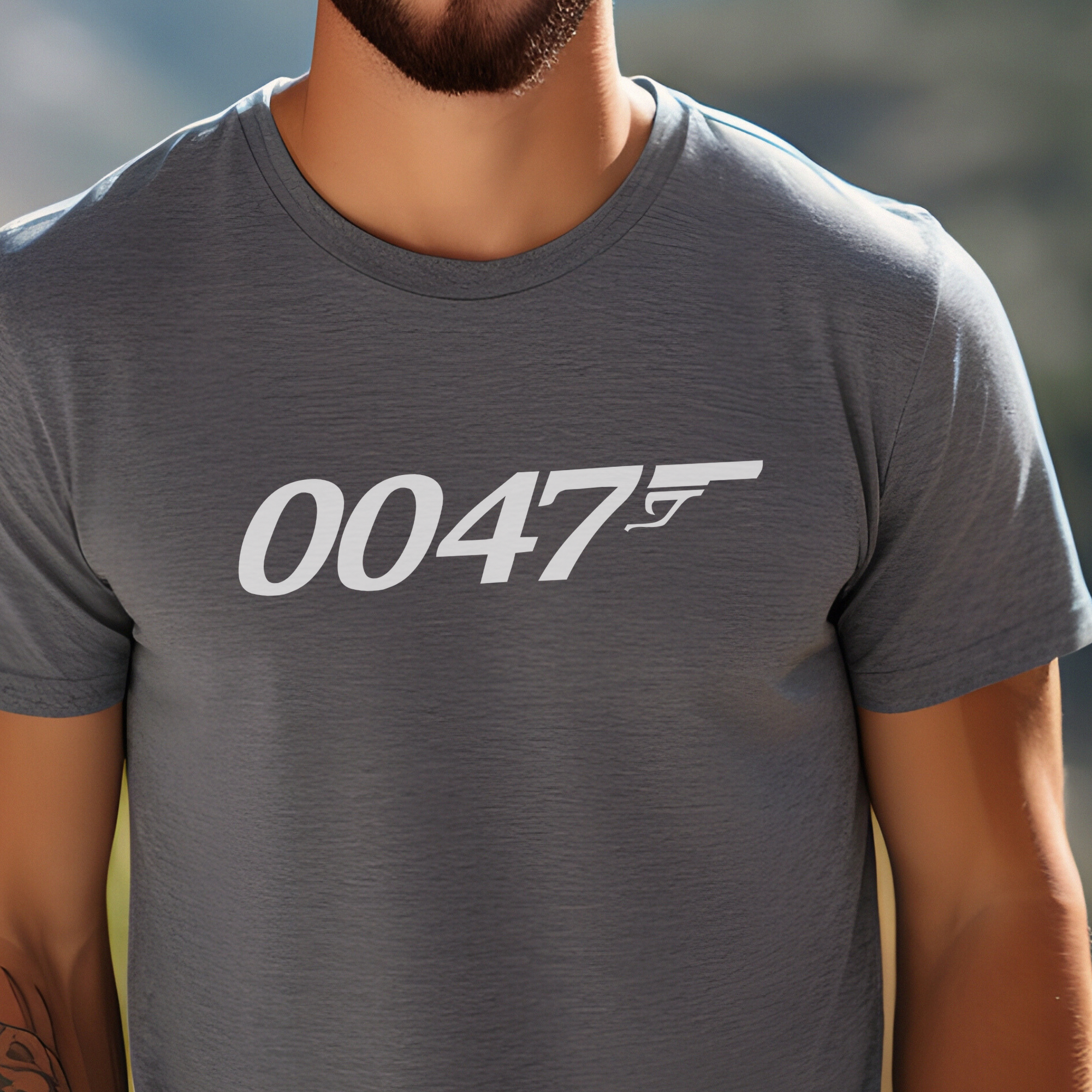 man wearing a gunmetal color t-shirt with '0047' printed  in white across the front