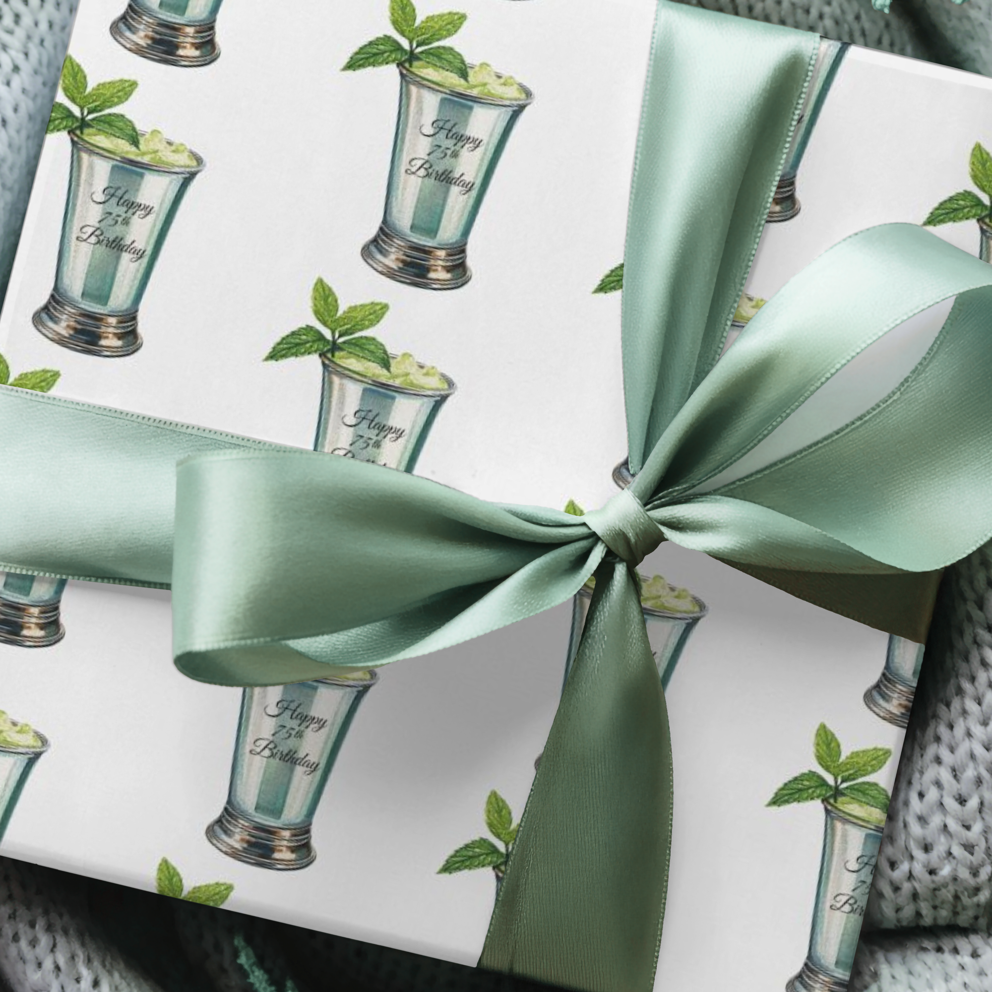 wrapping paper with a pattern featuring a mint julep in silver cup and a sprig of mint.