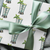wrapping paper with a pattern featuring a mint julep in silver cup and a sprig of mint.