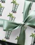 wrapping paper with a pattern featuring a mint julep in silver cup and a sprig of mint.