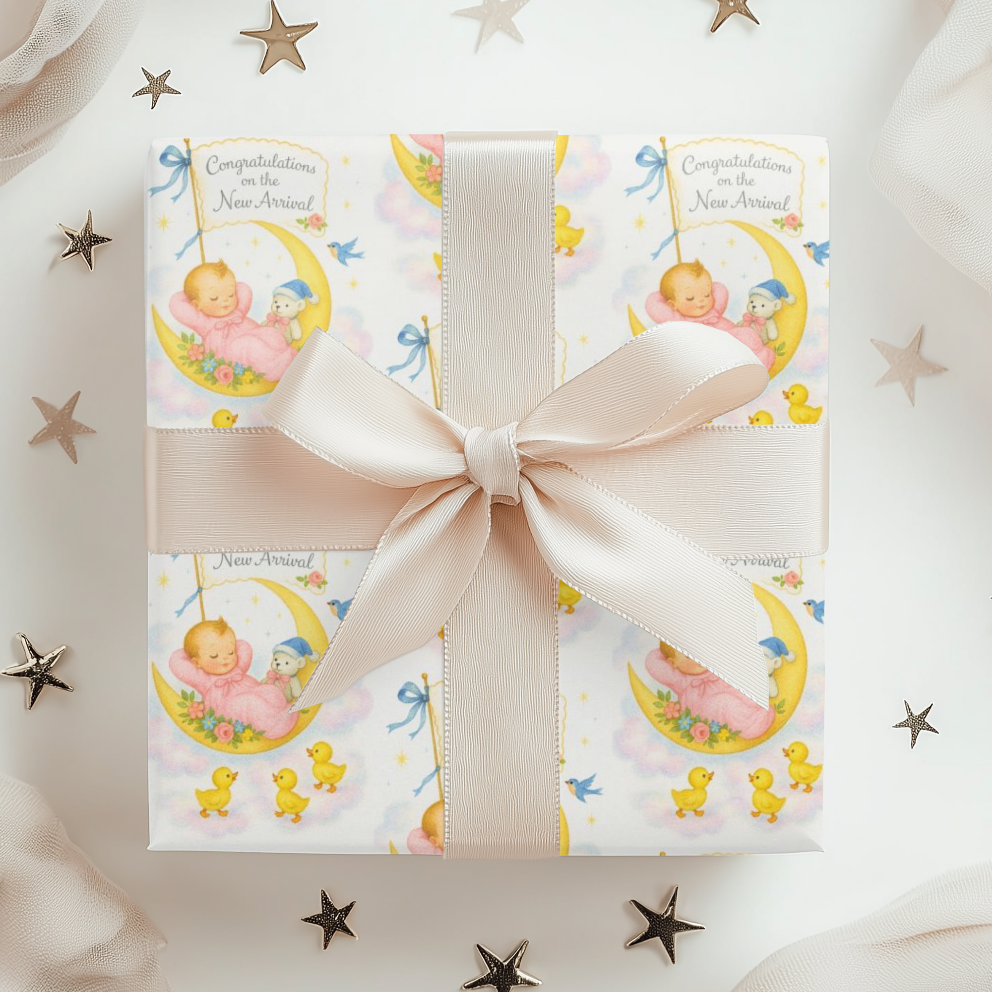 Wrapping paper in baby theme with moon baby and ducks in sweet pastels.
