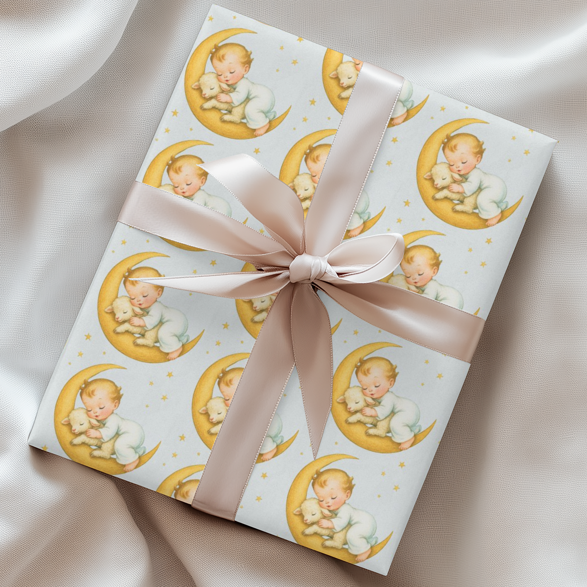 Gift wrapped in paper with baby illustrations and a pink ribbon on a soft background