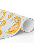 Roll of wrapping paper with baby and lamb on a moon design