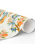 Roll of baby wrapping paper with a baby, birds and floral design on a white background.