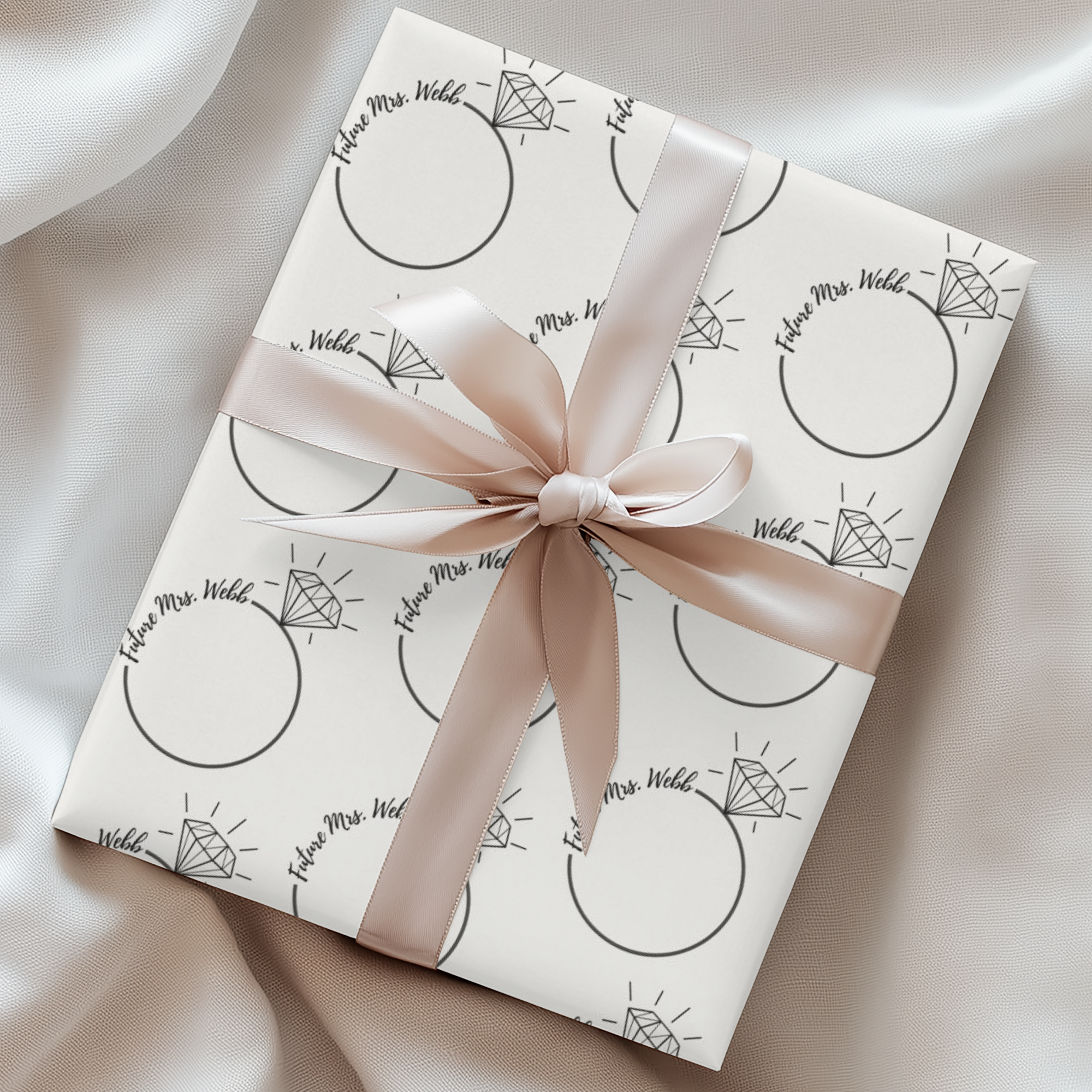Minimalist bridal gift wrap with personalized text and engagement rings.
