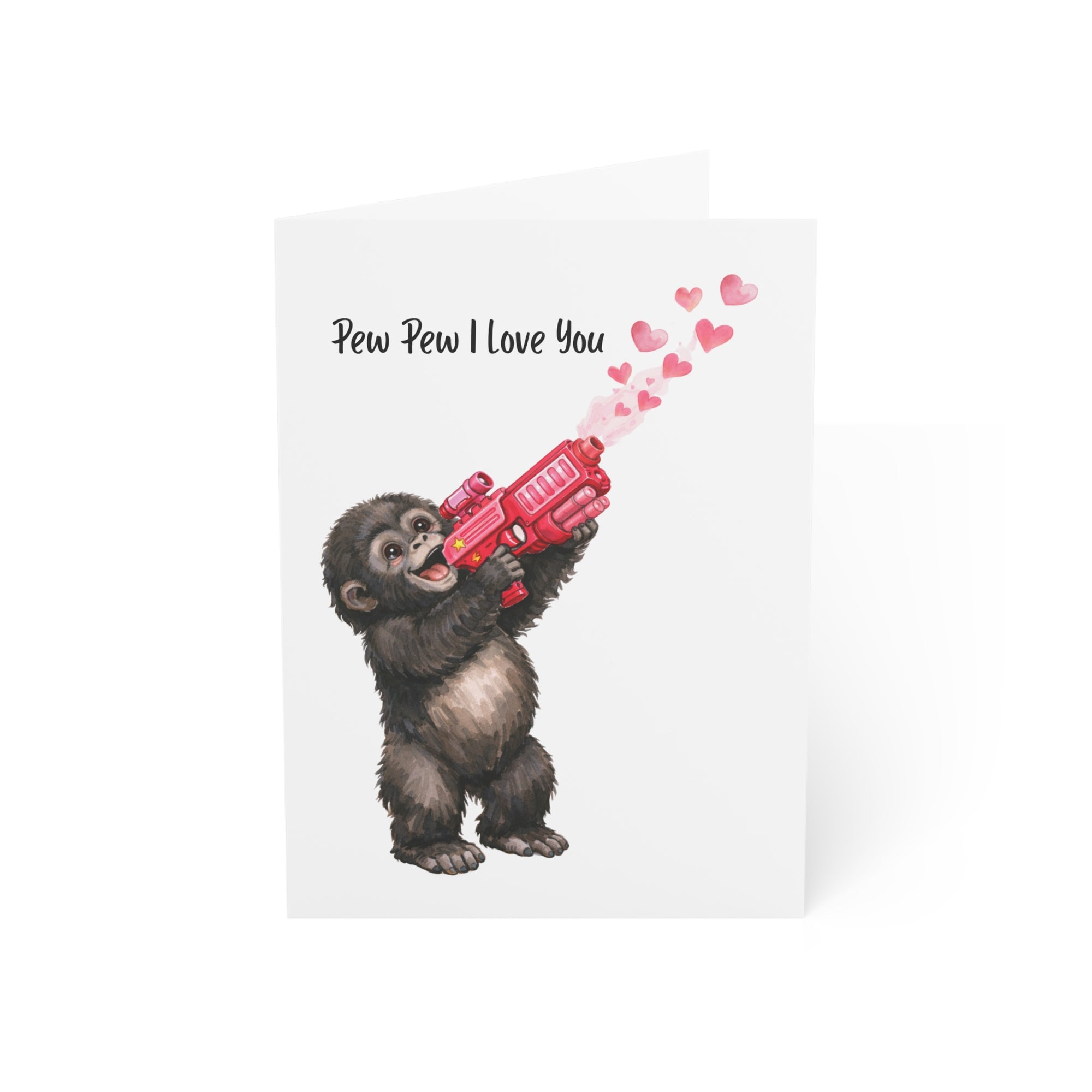 Card with a monkey holding a red gun shooting hearts, text 'Pew Pew I Love You' on a white background.
