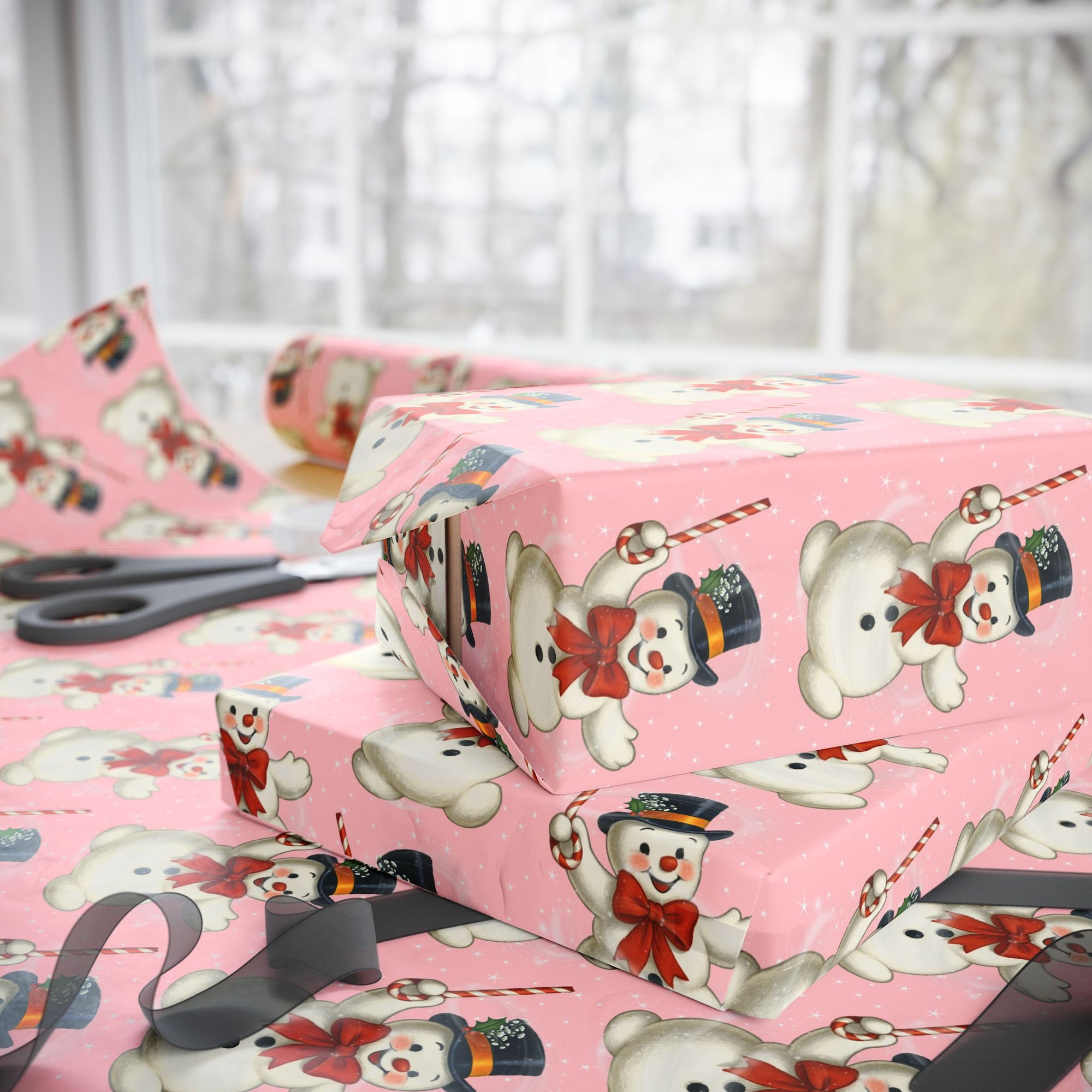 pink wrapping paper with snowman and peppermint candy canes