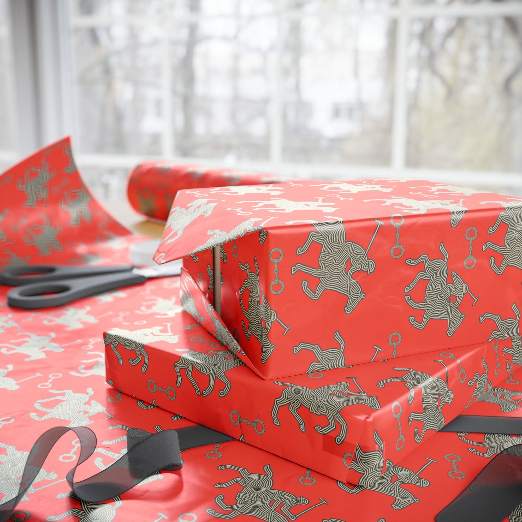Red wrapping paper featuring silver polo players in a horse and rider pattern.