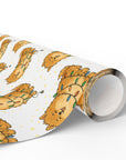 christmas wrapping paper roll featuring a pomeranian wrapped in Christmas lights.