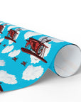 Wrapping paper with a pattern of red biplanes flying through a blue sky with white clouds.