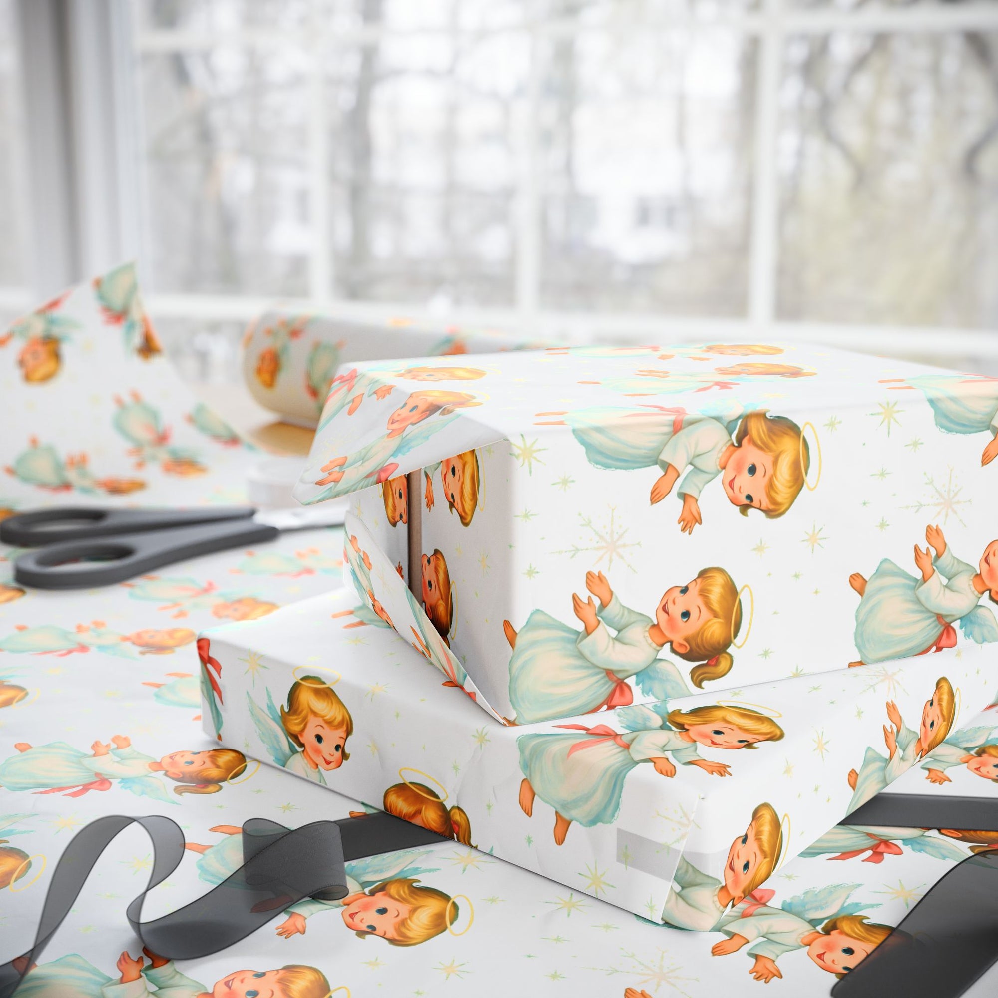 Gift wrap with angel designs on a white background side view