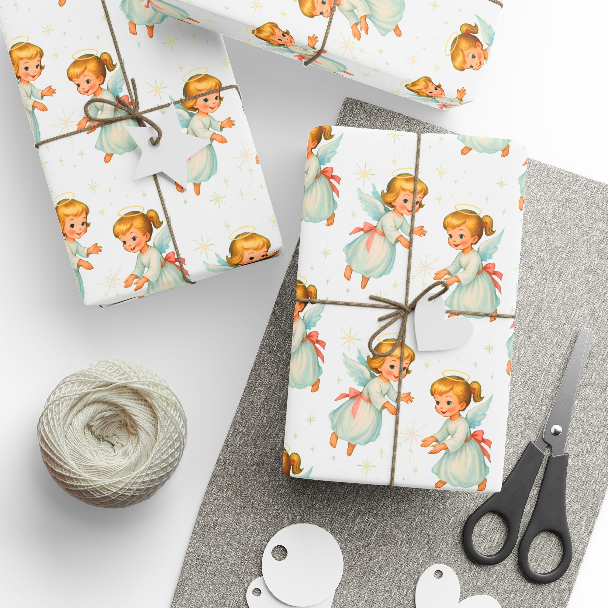 Gift wrap with angel designs on a white background front view