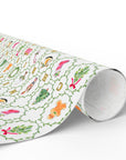 Roll of decorative paper with colorful patterns on a white background