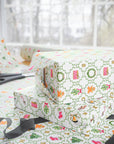 Gift boxes wrapped in colorful patterned paper with ribbons and scissors on a matching surface.