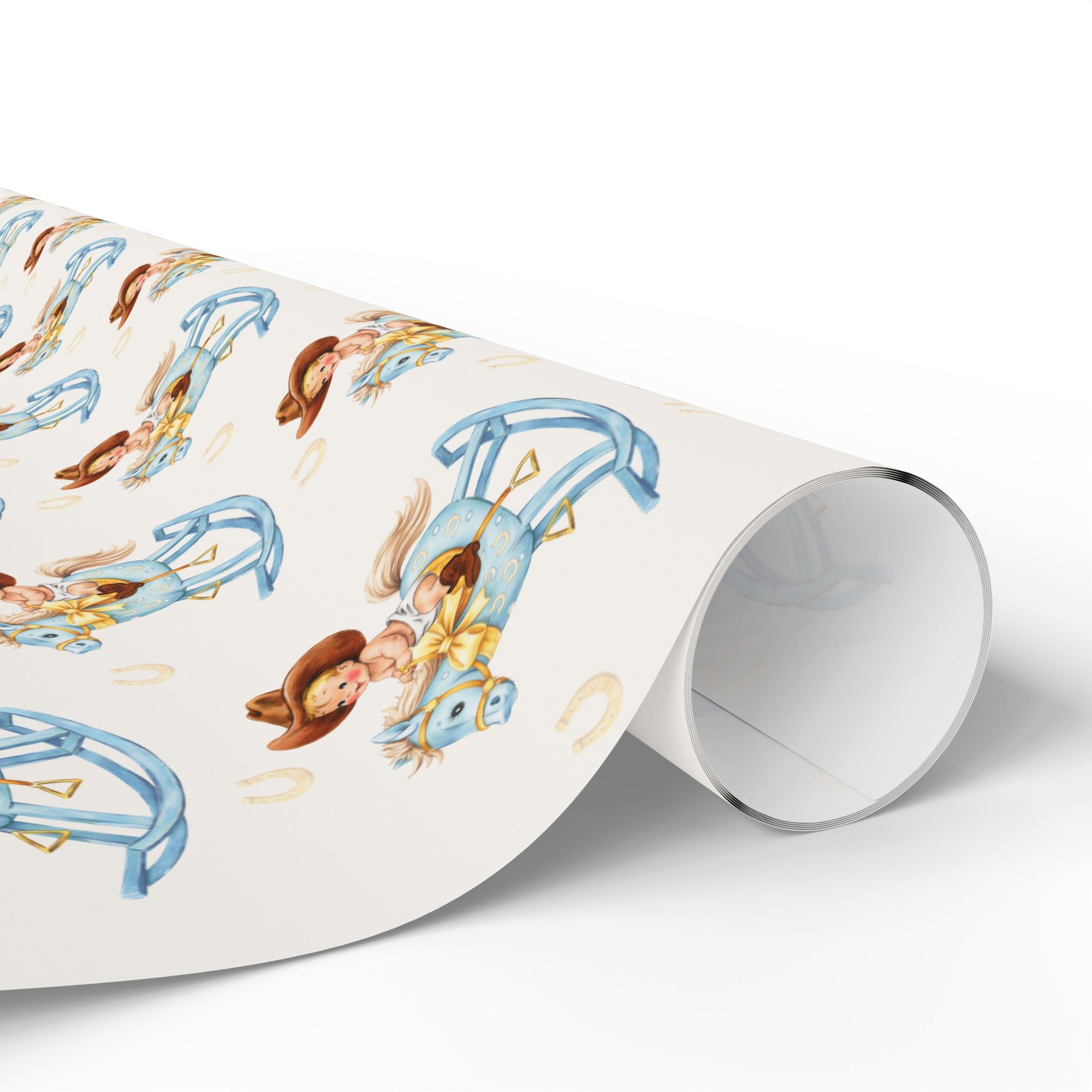 Roll of wrapping paper with vintage-style illustrations of a western baby on a rocking horse.