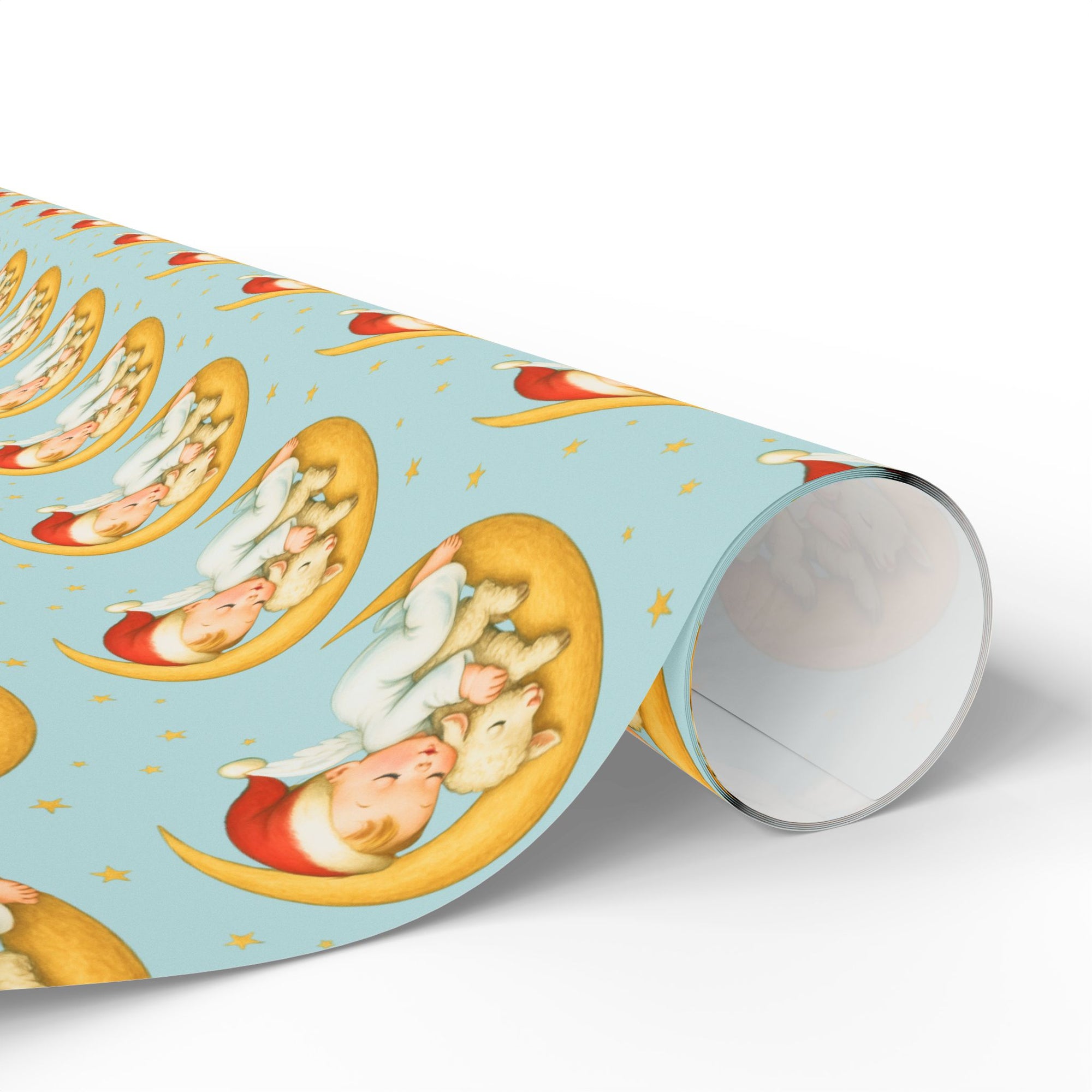 Roll of christmas wrapping paper with lamb and baby design on blue background.