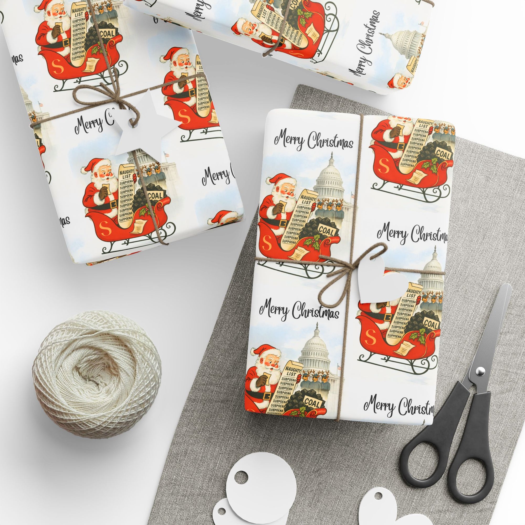 Gift wrapped in Christmas-themed paper with Santa Claus delivering coal to naughty politicians table view