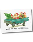 Classic Christmas card featuring Santa in a  lowrider car bouncing on hydraulics with presents in back.