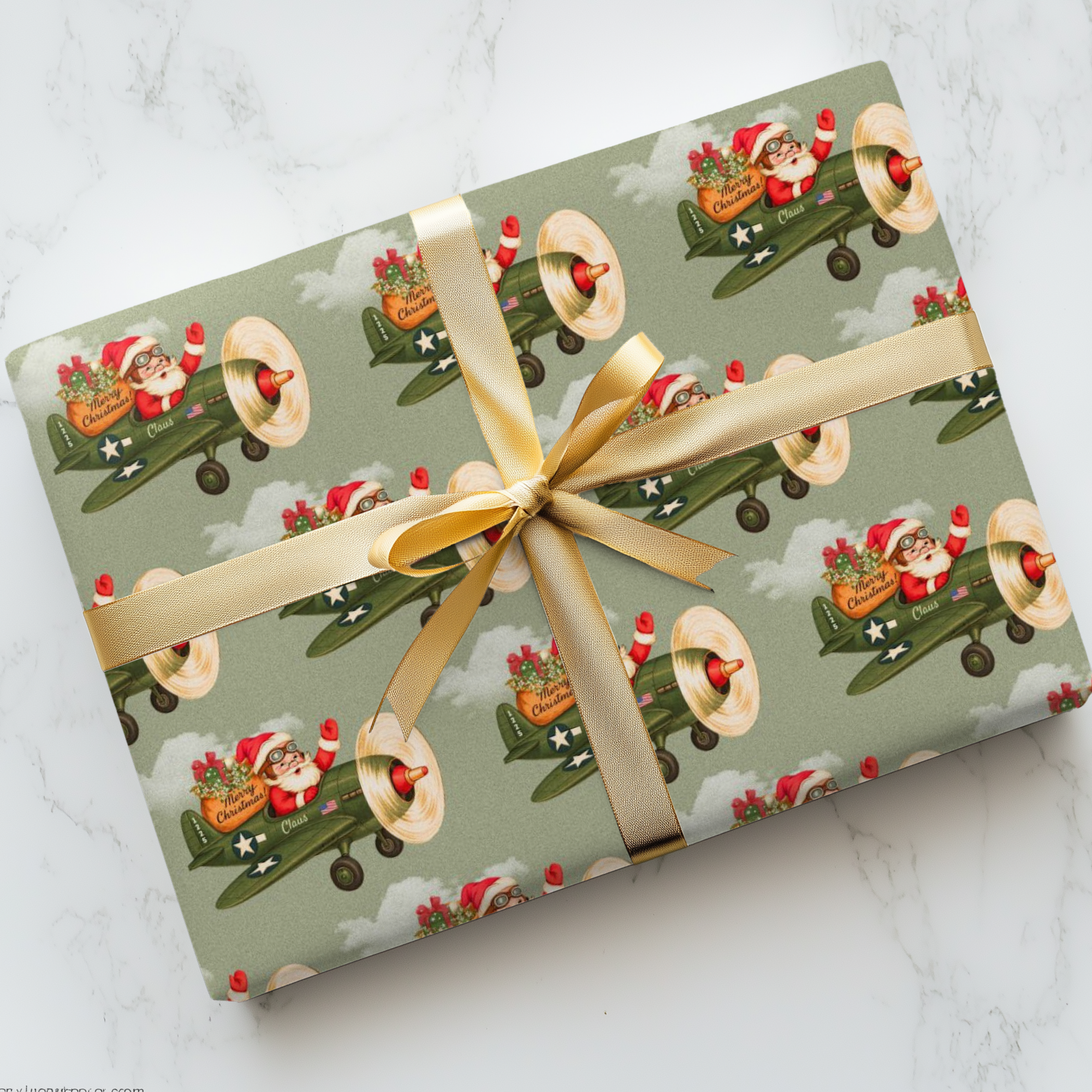 Christmas wrapping paper featuring a retro Santa flying a WW2 vintage airplane with gifts to deliver.
