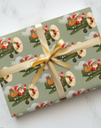 Christmas wrapping paper featuring a retro Santa flying a WW2 vintage airplane with gifts to deliver.