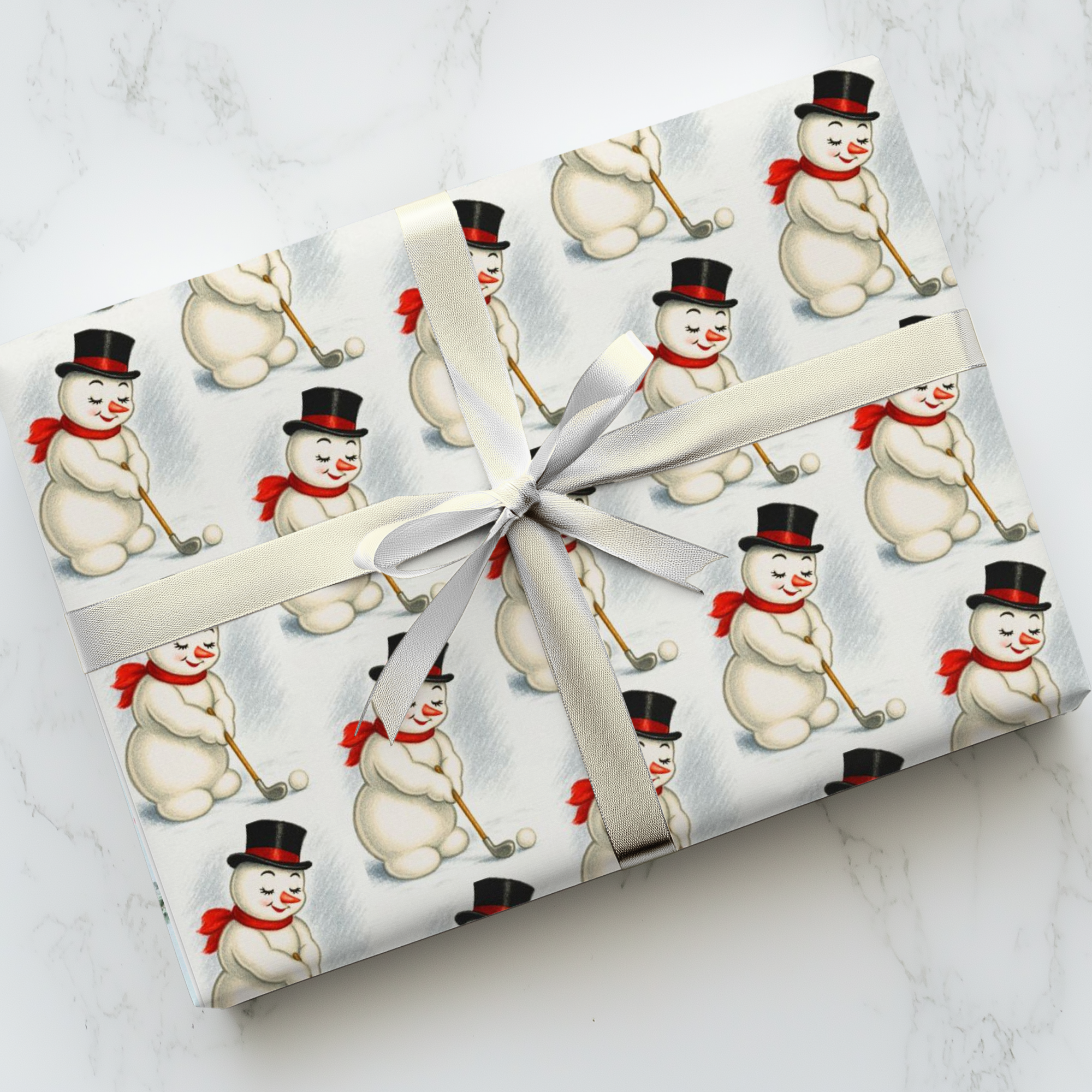 vintage golfing snowman Christmas wrapping paper with retro 1950s snowman in top hat and red scarf holding a golf club.
