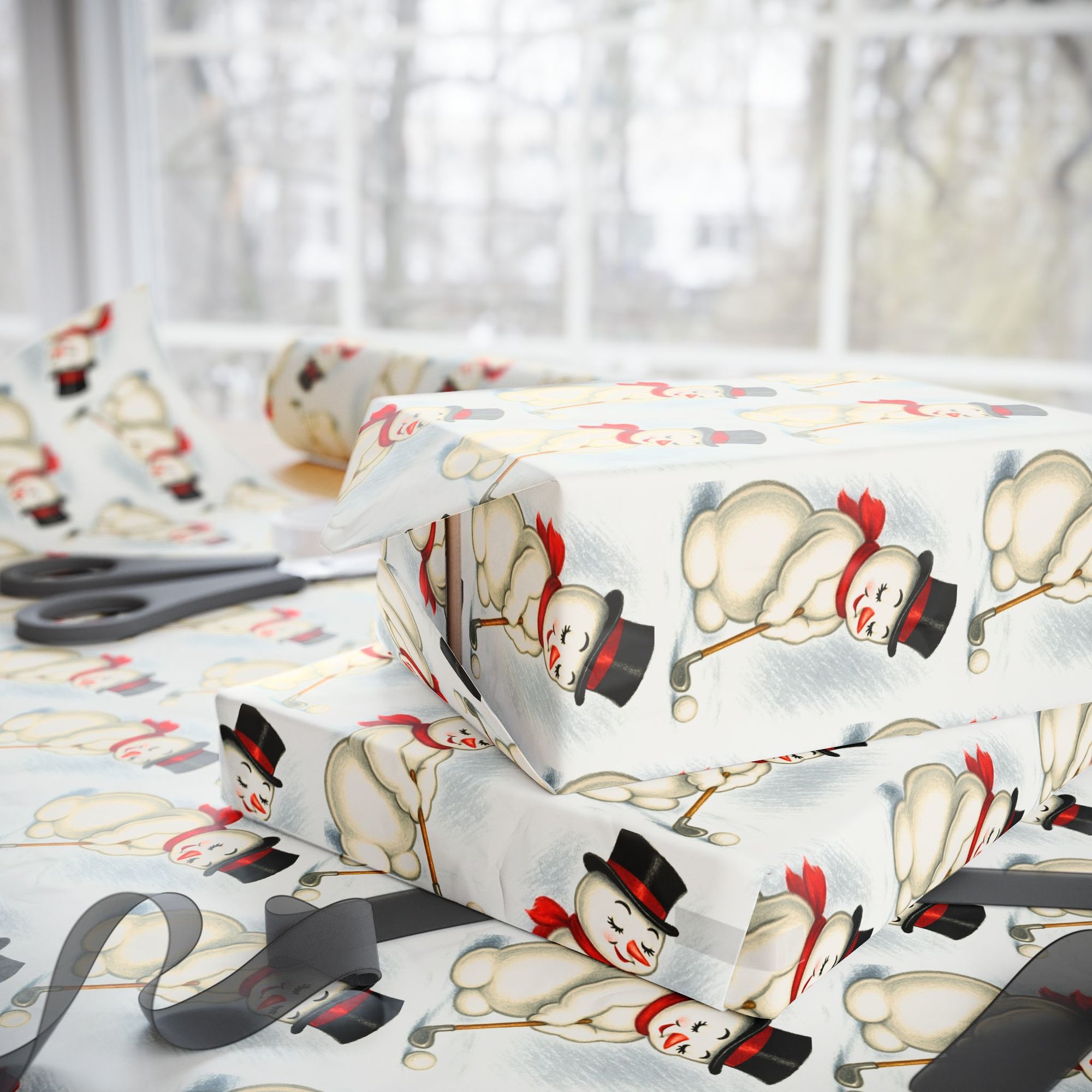 present wrapped in christmas themed paper featuring a snowman putting.