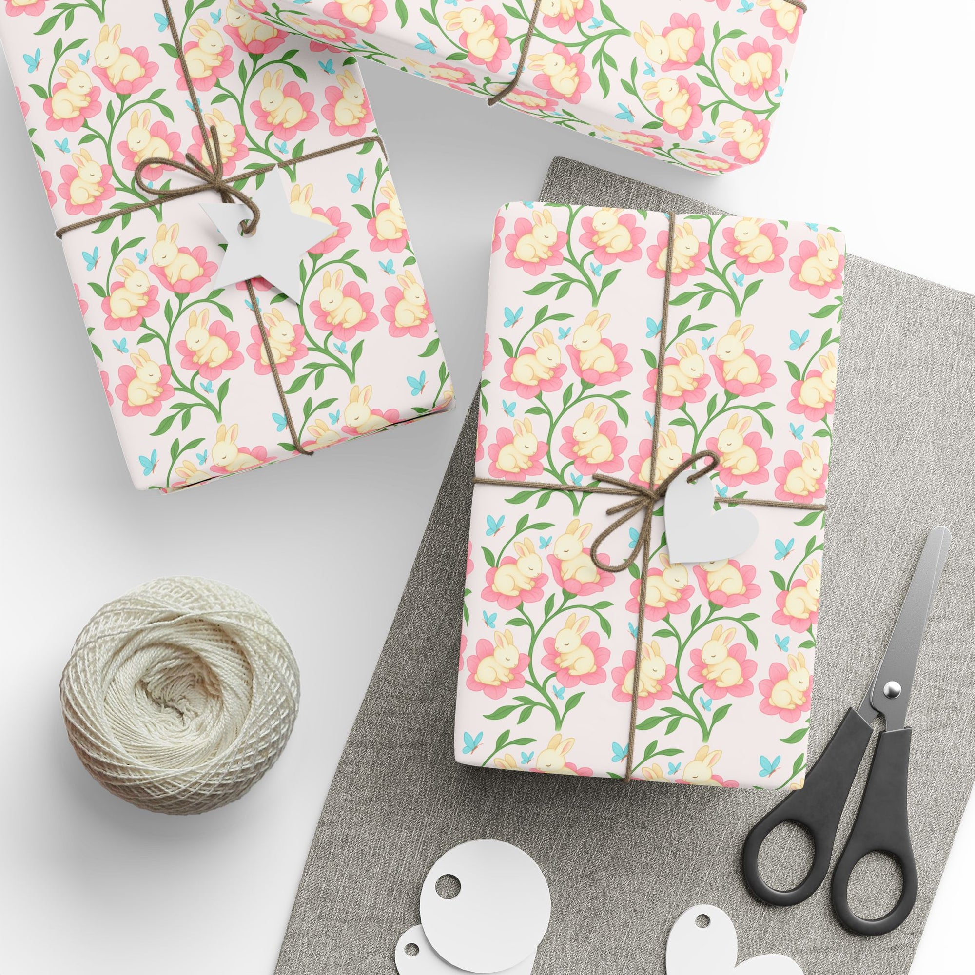 Spring wrapping paper with baby bunnies inside pink flowers and blue butterflies