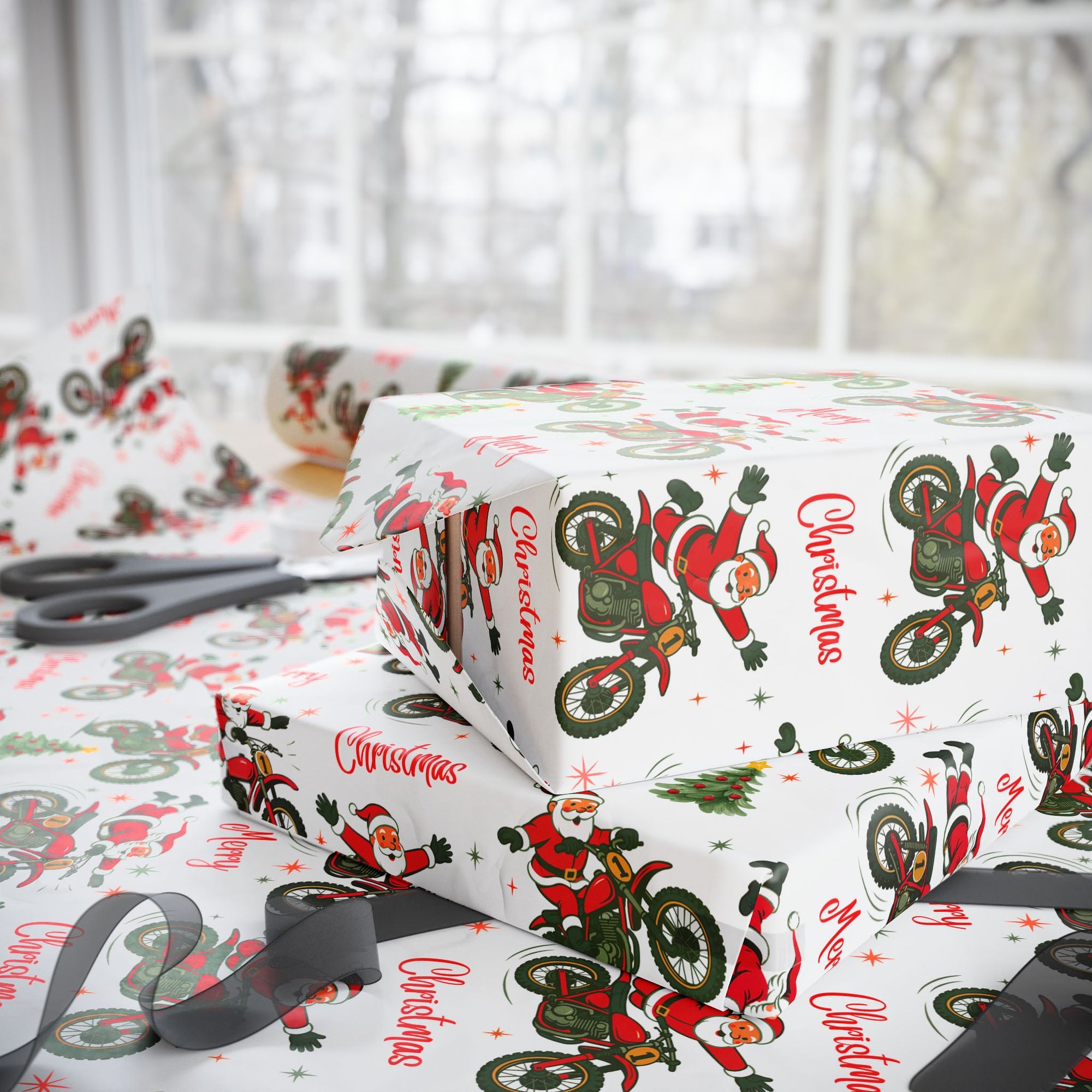 Christmas wrapping paper featuring Santa on a dirt bike doing tricks on a white background.