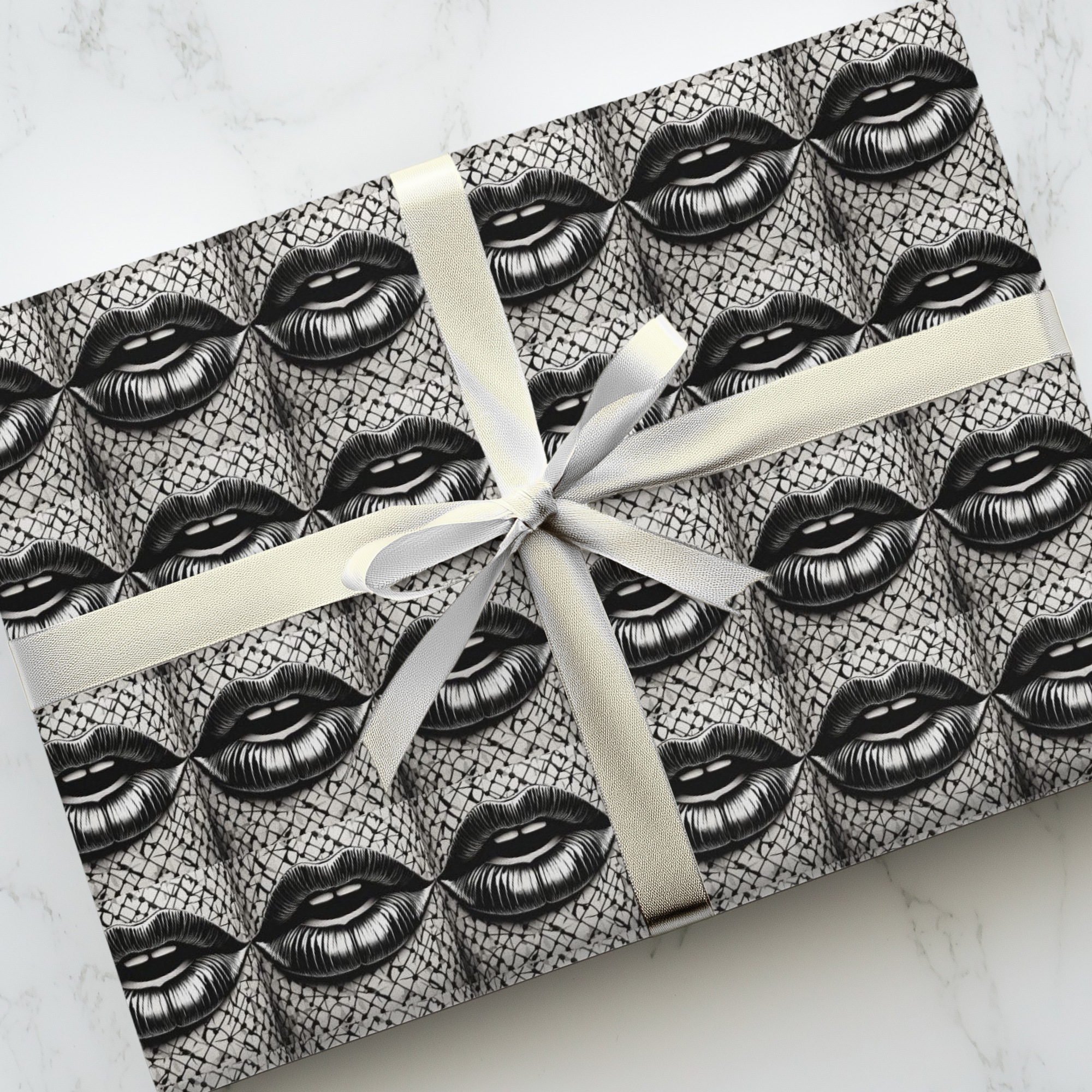 Surreal lips wrapping paper featuring a black and white repeating surrealist pattern from the Icona Obscura series.