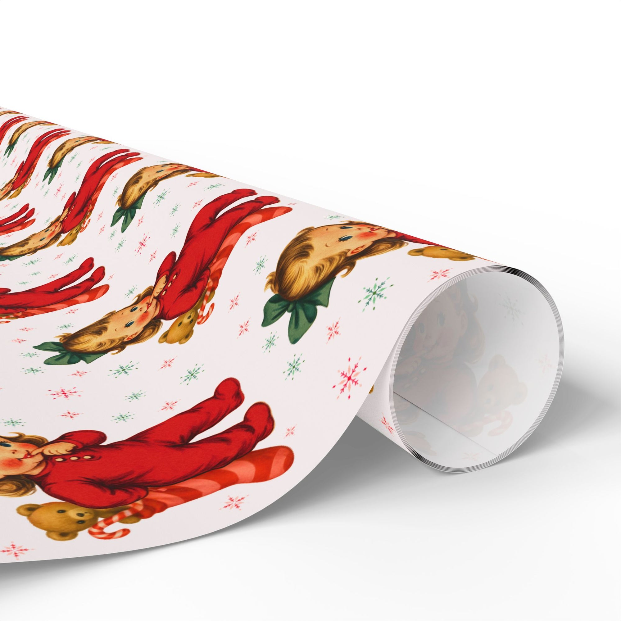 Roll of Christmas-themed wrapping paper with little girl and teddy bear design.