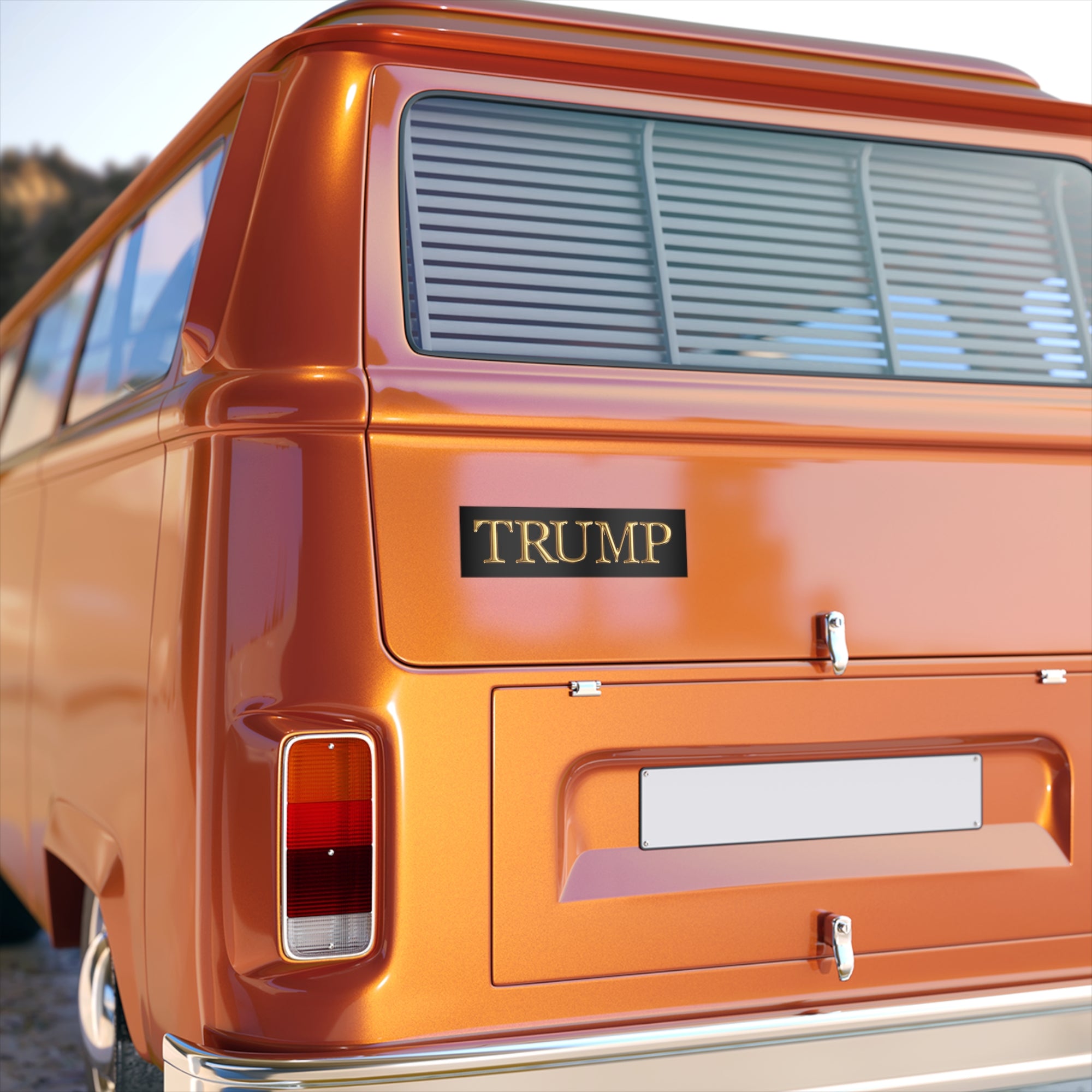 Orange van with a 'TRUMP' logo on the back