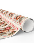 Roll of vintage-style wrapping paper with cherub designs on a white background