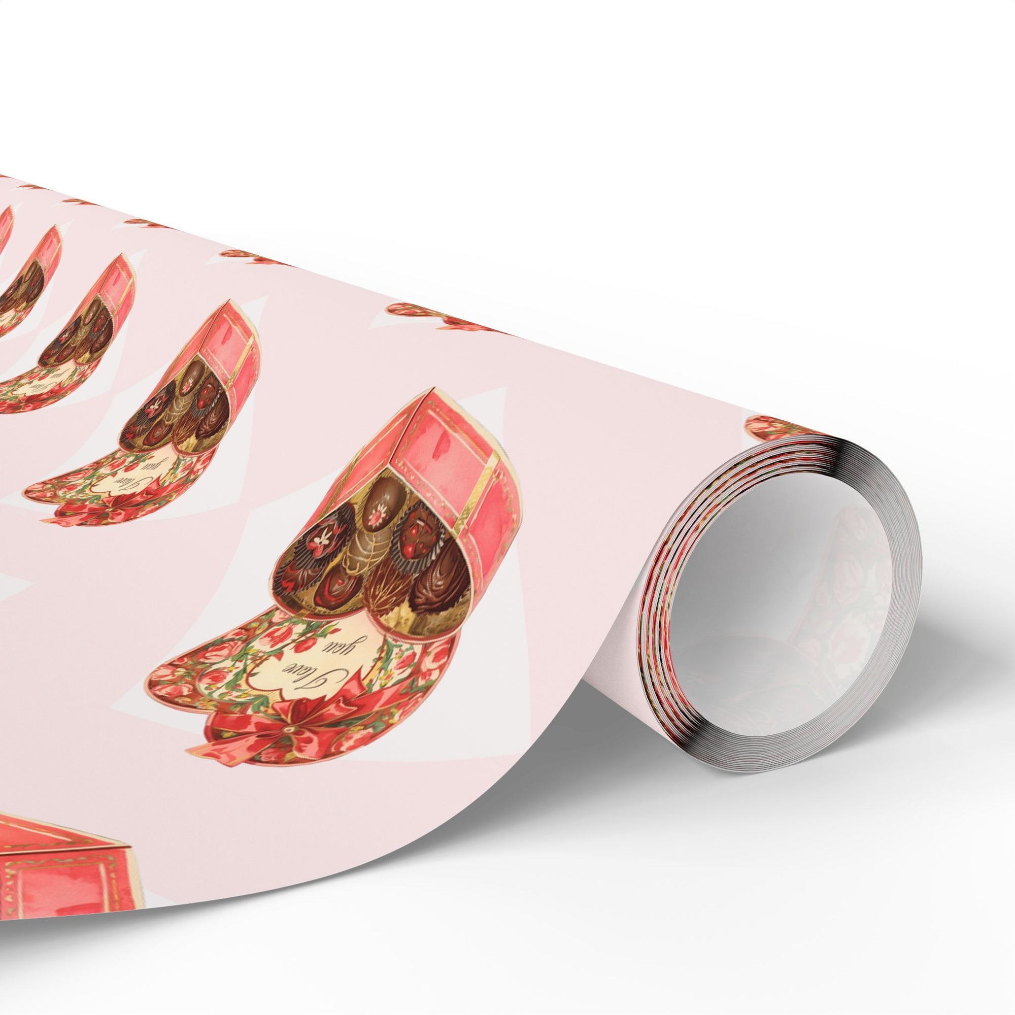 Retro wrapping paper roll that features heart-shaped candy boxes against a pink background.