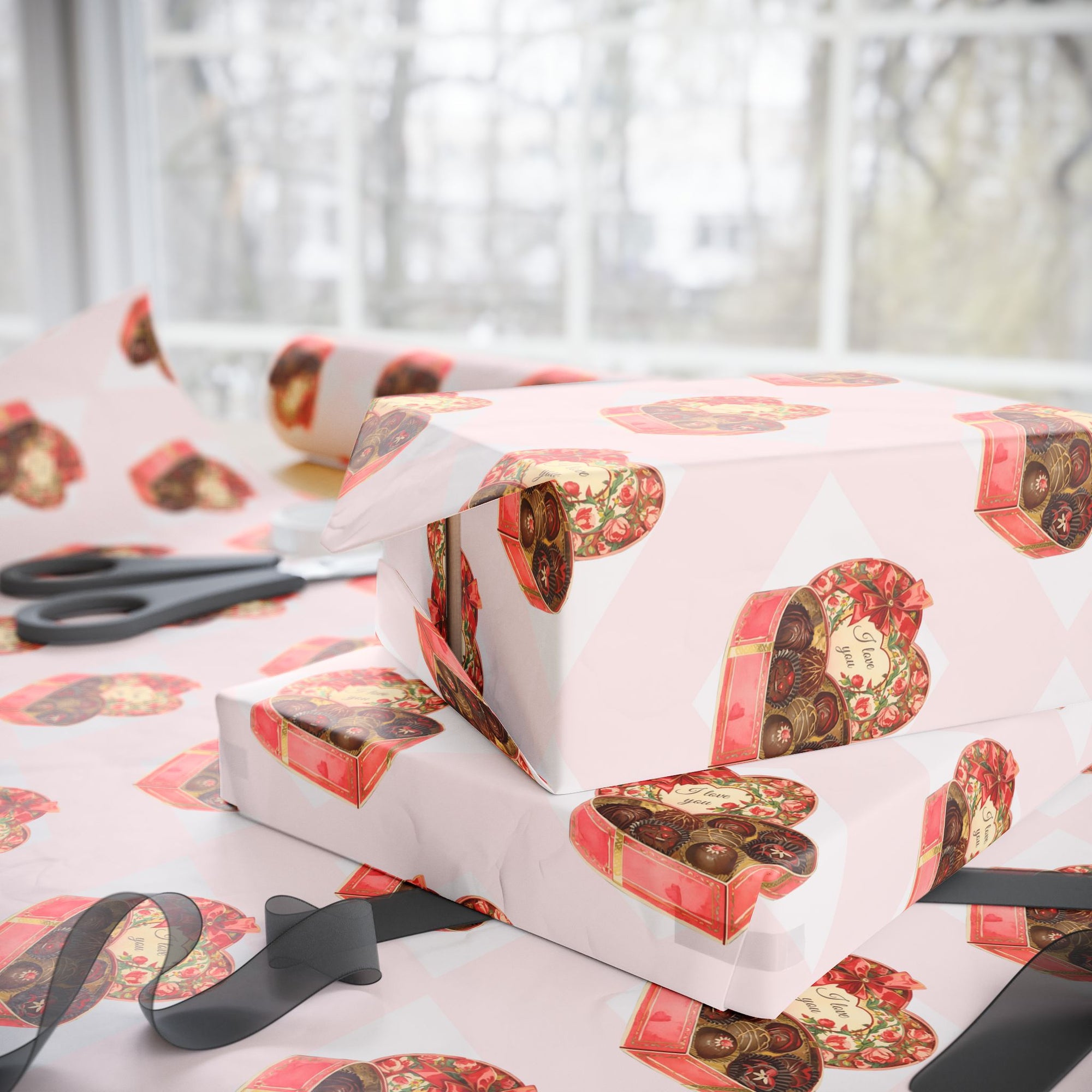 Retro wrapping paper that features heart-shaped candy boxes against a blush background.