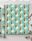 1960s inspirited wrapping paper featuring a retro bride and groom in winter wedding wear on a turquoise background