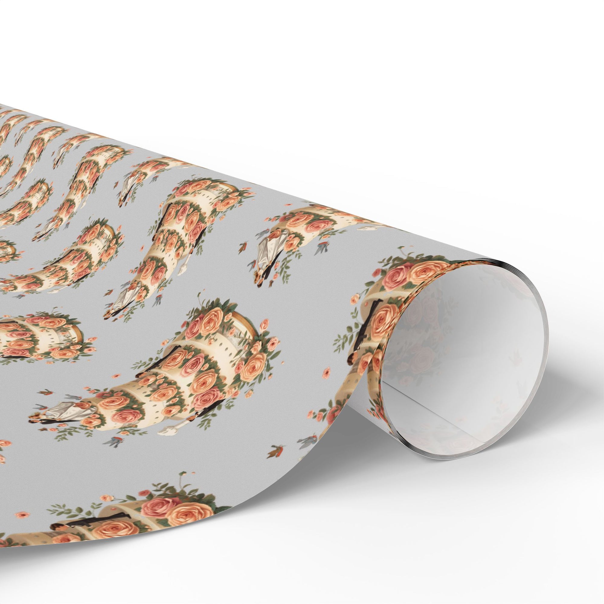 Roll of wrapping paper with a tiered wedding cake and bride and groom topper.