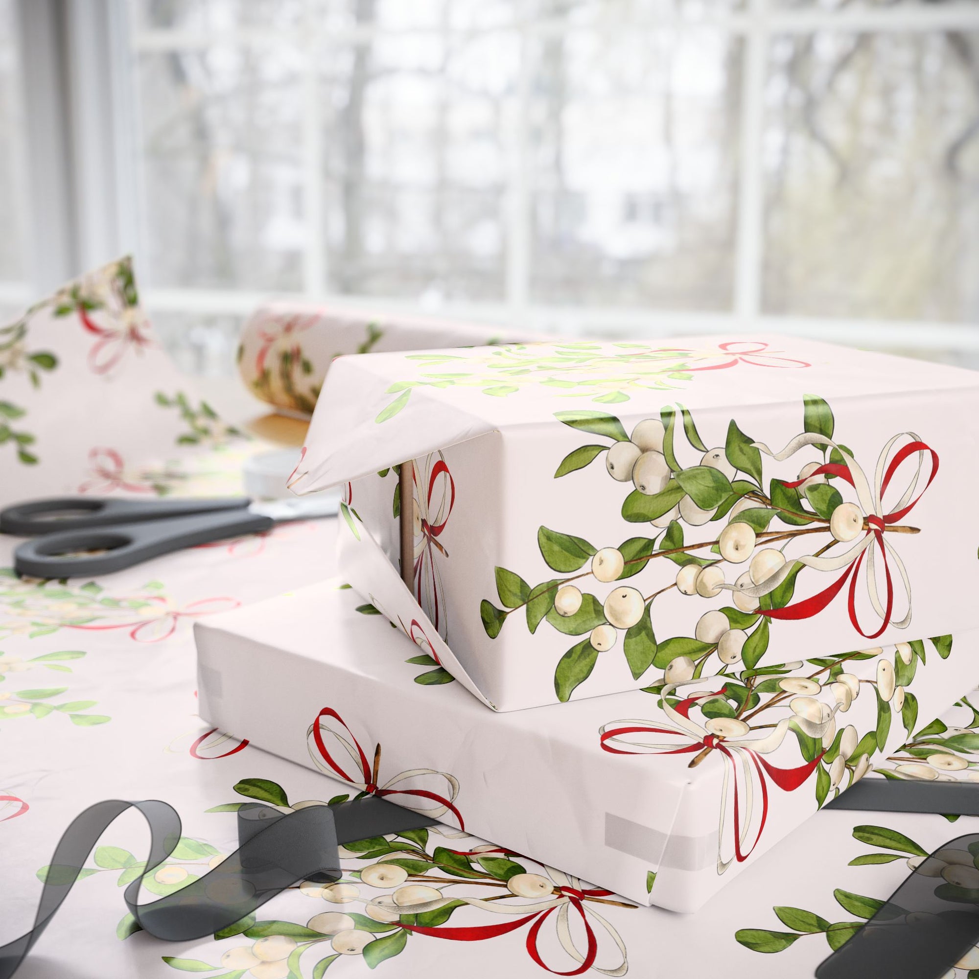 Vintage mistletoe wrapping paper with green leaves and red bows on blush background
