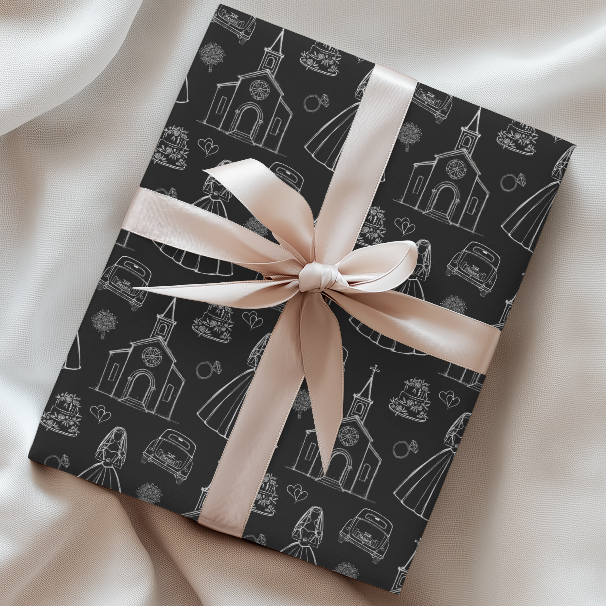 Wedding gift wrapped in black and white pattern and wrapped in a pink silk bow. 