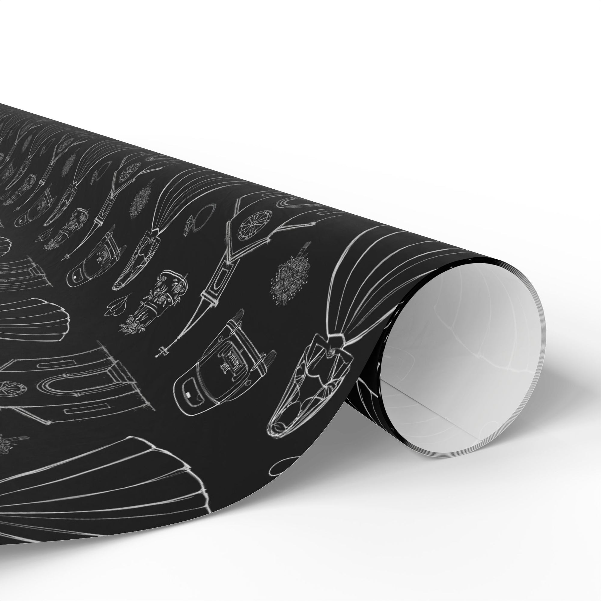 Roll of black and white wedding gift wrap on a white background.