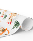 Christmas wrapping paper featuring a sweet westie dog in a santa hat skiing down alpine slopes, on a snowy background.