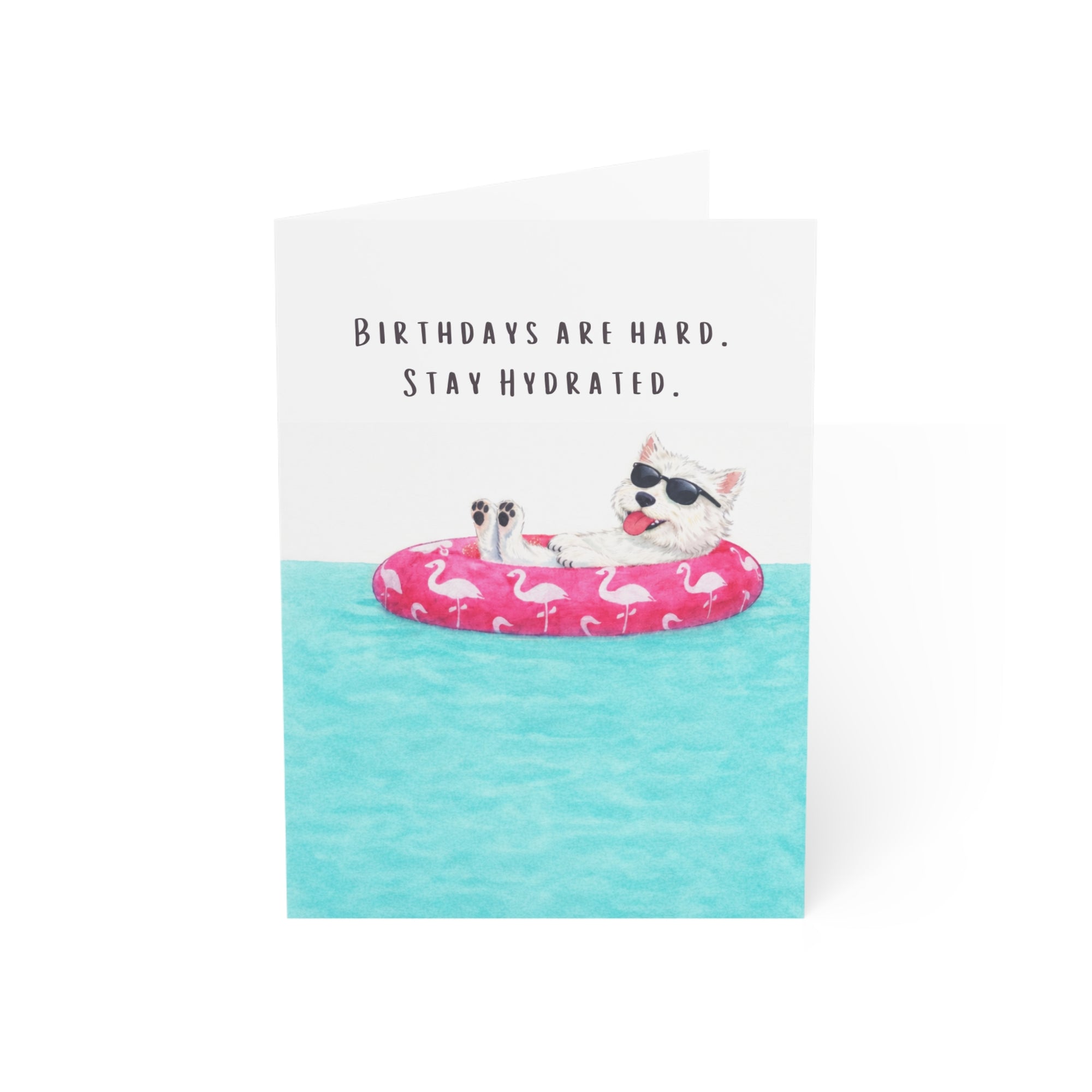 Funny dog birthday card with westie dog floating on pink flamingo pool float wearing sunglasses