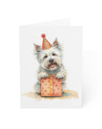 Birthday card featuring a westie dog wearing a party hat with a gift box on a white background