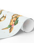 Roll of decorative paper with bunny mom and baby design on a white background.