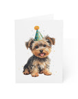 Card illustration of a yorkie dog wearing a party hat on a white background
